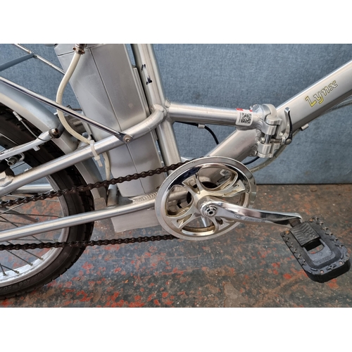 284 - A PowaCycle Lynx electric folding bike (key in office)