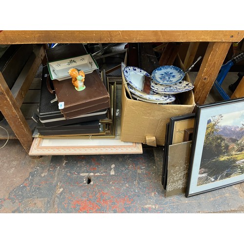 399 - A large collection of house clearance items to include brass kettle, framed prints, garden hedge tri... 