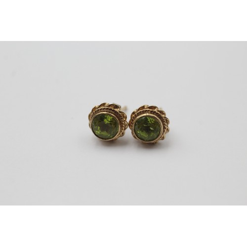 1007 - Three pairs of 9ct gold earrings, one garnet, one amethyst and one peridot - approx. gross weight 5.... 