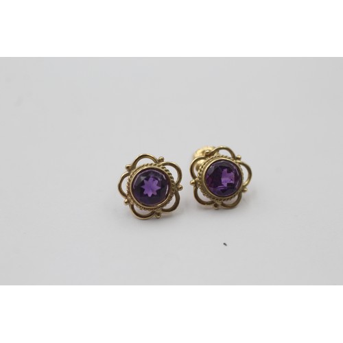 1008 - Two pairs of 9ct gold gemstone earrings, one amethyst and one sapphire - approx. gross weight 1.8 gr... 