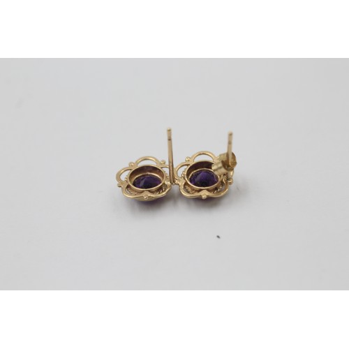 1008 - Two pairs of 9ct gold gemstone earrings, one amethyst and one sapphire - approx. gross weight 1.8 gr... 