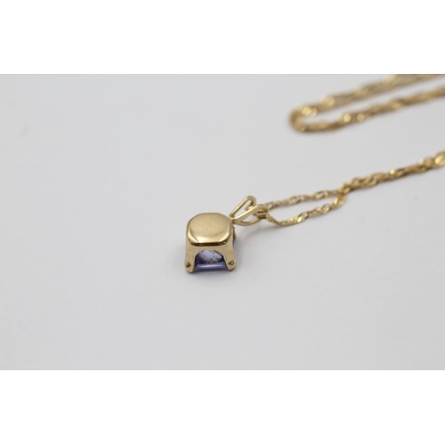 1013 - A 9ct gold purple gemstone pendant necklace and stud earrings set - approx. gross weight 2.5 grams