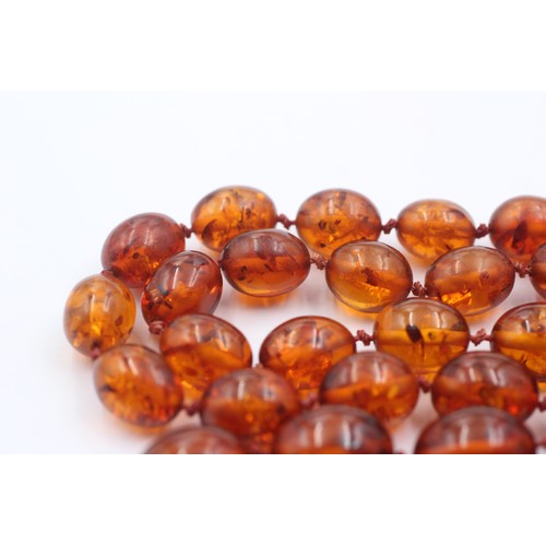 1019 - An amber beaded single strand necklace with 9ct gold clasp - approx. gross weight 40.5 grams