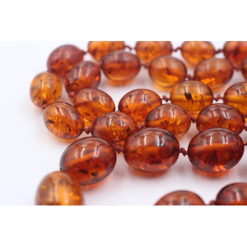 1019 - An amber beaded single strand necklace with 9ct gold clasp - approx. gross weight 40.5 grams