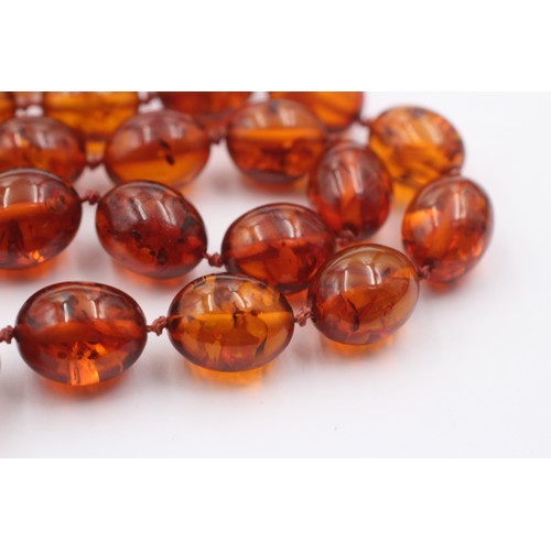 1019 - An amber beaded single strand necklace with 9ct gold clasp - approx. gross weight 40.5 grams