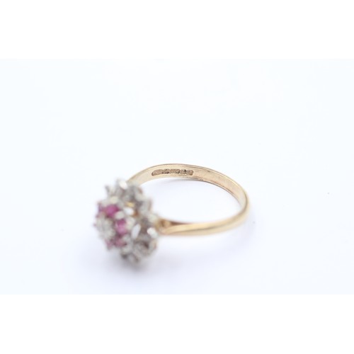 1020 - A 9ct gold diamond and ruby halo ring - approx. gross weight 3.5 grams