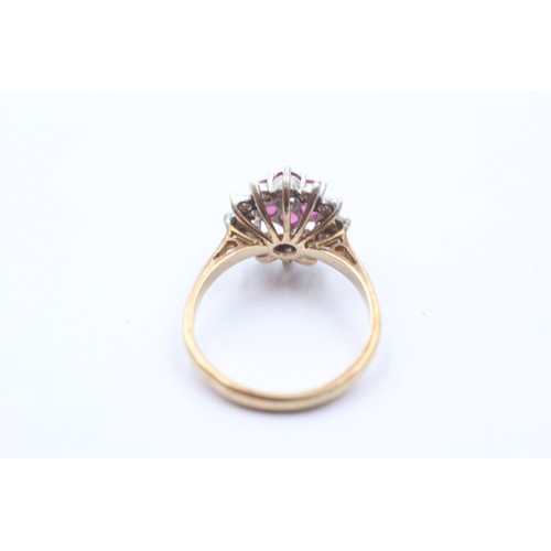 1020 - A 9ct gold diamond and ruby halo ring - approx. gross weight 3.5 grams