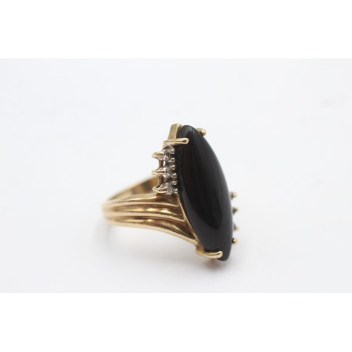 1021 - A 9ct gold diamond and onyx dress ring - approx. gross weight 5.5 grams