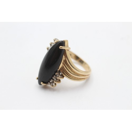 1021 - A 9ct gold diamond and onyx dress ring - approx. gross weight 5.5 grams