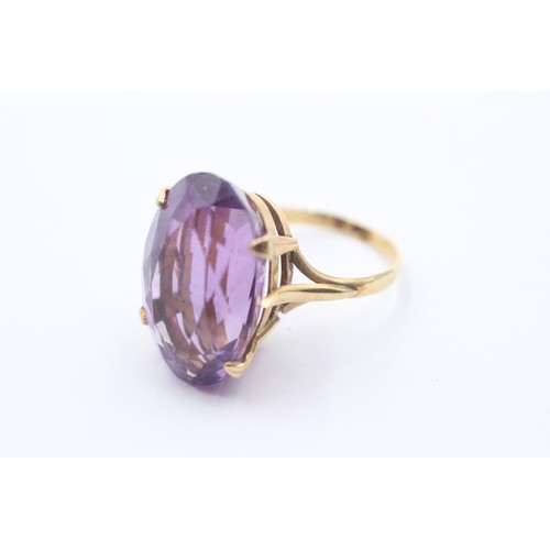 1023 - A 9ct gold amethyst single stone cocktail ring - approx. gross weight 6.6 grams