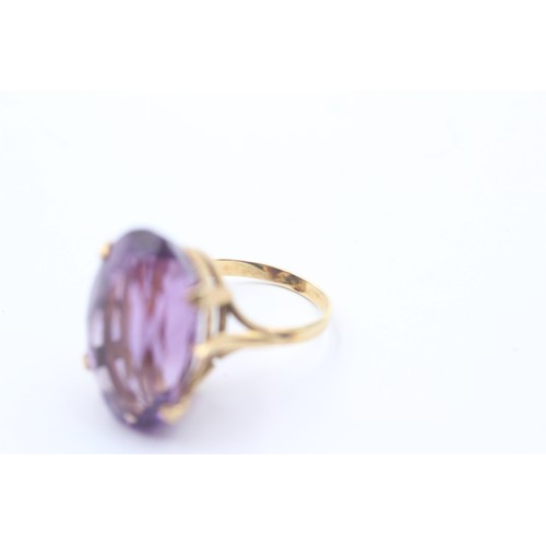 1023 - A 9ct gold amethyst single stone cocktail ring - approx. gross weight 6.6 grams