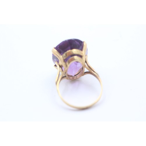 1023 - A 9ct gold amethyst single stone cocktail ring - approx. gross weight 6.6 grams