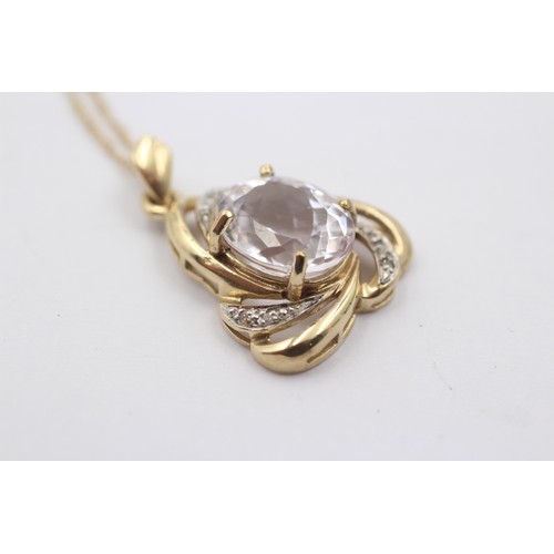 1025 - A 9ct gold diamond and white spodumene pendant necklace - approx. gross weight 4.4 grams