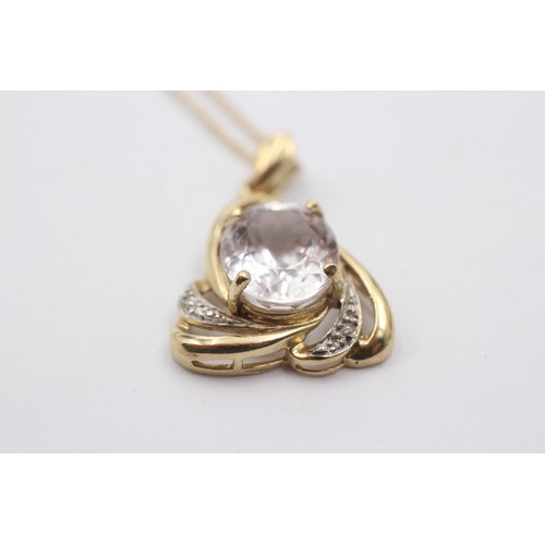 1025 - A 9ct gold diamond and white spodumene pendant necklace - approx. gross weight 4.4 grams