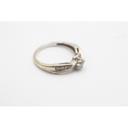 1028 - A 9ct white gold diamond single stone ring with diamond set shank - approx. gross weight 2.1 grams