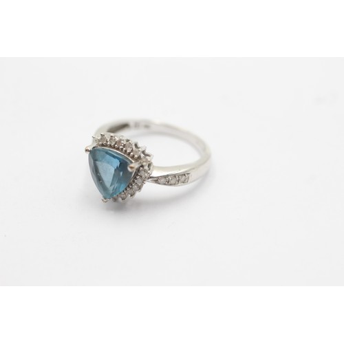 1029 - A 9ct white gold diamond and topaz dress ring - approx. gross weight 2.8 grams