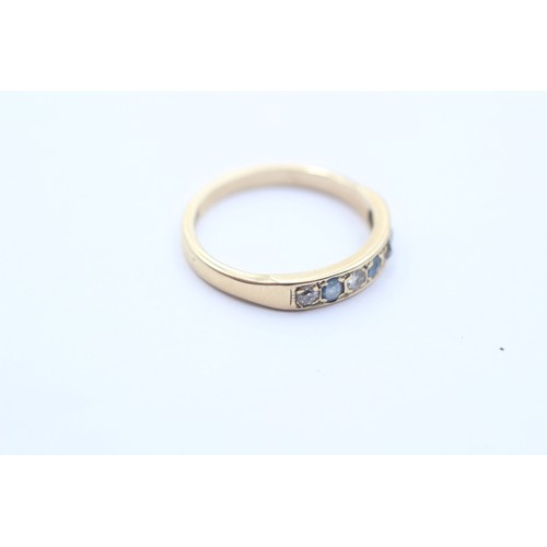 1033 - A 9ct gold diamond and sapphire seven stone ring - approx. gross weight 2.1 grams