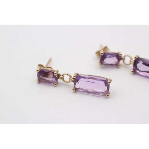 1034 - A pair of 9ct gold amethyst drop earrings - approx. gross weight 2.4 grams