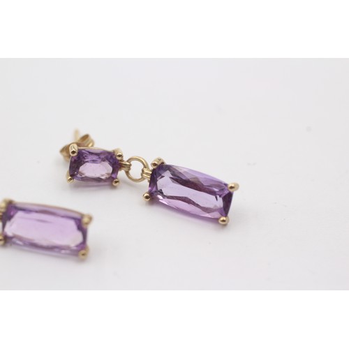 1034 - A pair of 9ct gold amethyst drop earrings - approx. gross weight 2.4 grams