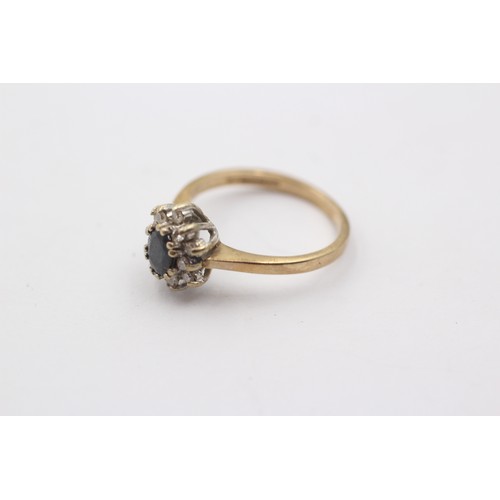 1038 - A 9ct gold diamond and sapphire cluster ring - approx. gross weight 2.1 grams