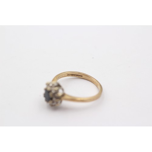 1038 - A 9ct gold diamond and sapphire cluster ring - approx. gross weight 2.1 grams