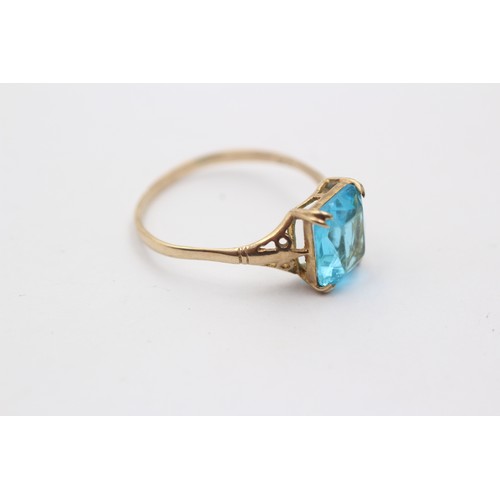 1039 - A 9ct gold blue paste single stone ring - approx. gross weight 1.7 grams