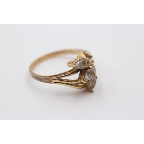 1041 - A stamped 14k gold diamond and topaz dress ring - approx. gross weight 3 grams