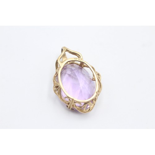 1044 - A 9ct gold amethyst pendant - approx. gross weight 5.6 grams