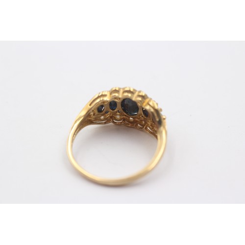 1045 - A 9ct gold sapphire five stone ring with diamond surround - approx. gross weight 4.1 grams