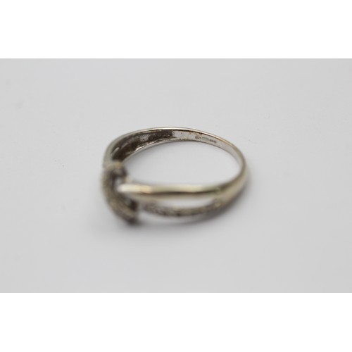 1054 - A 9ct white gold diamond twist ring - approx. gross weight 1.8 grams