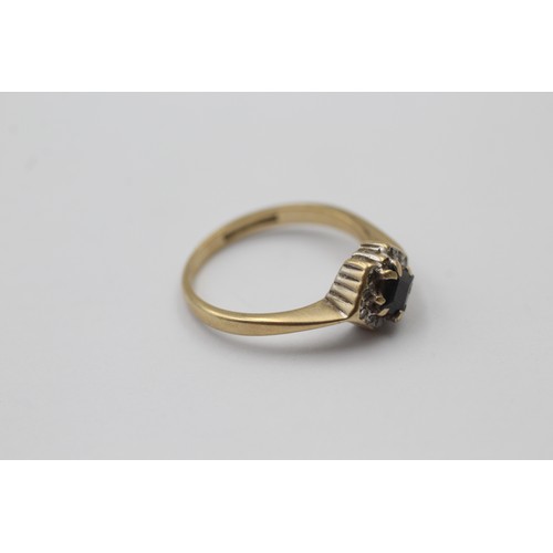 1057 - A 9ct gold sapphire and diamond dress ring - approx. gross weight 2.1 grams