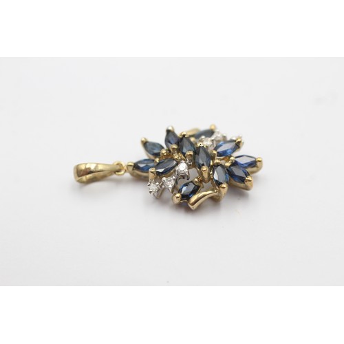 1063 - A 9ct gold diamond and sapphire cluster pendant - approx. gross weight 1.6 grams