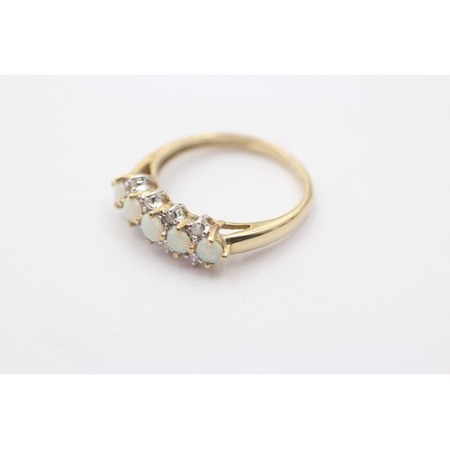 1069 - A 9ct gold diamond and opal dress ring - approx. gross weight 1.9 grams