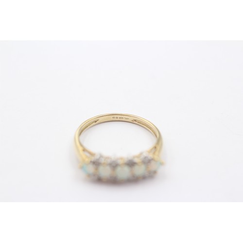 1069 - A 9ct gold diamond and opal dress ring - approx. gross weight 1.9 grams