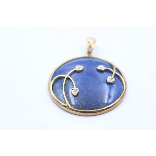 1072 - A 9ct gold diamond and lapis lazuli round pendant - approx. gross weight 7.3 grams