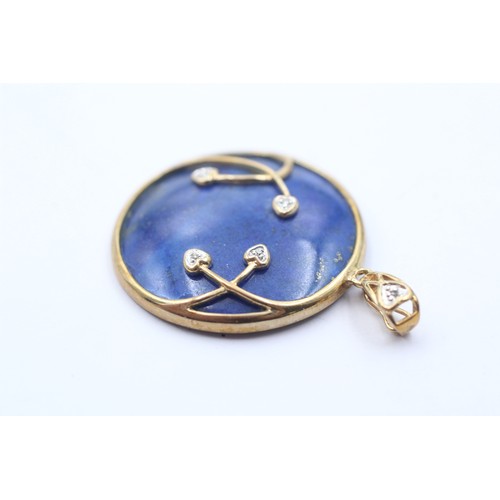 1072 - A 9ct gold diamond and lapis lazuli round pendant - approx. gross weight 7.3 grams