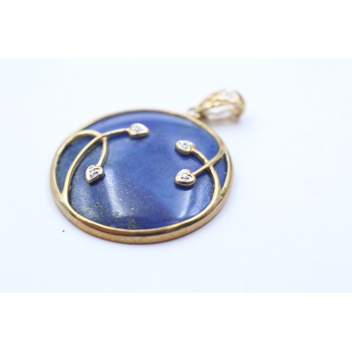 1072 - A 9ct gold diamond and lapis lazuli round pendant - approx. gross weight 7.3 grams