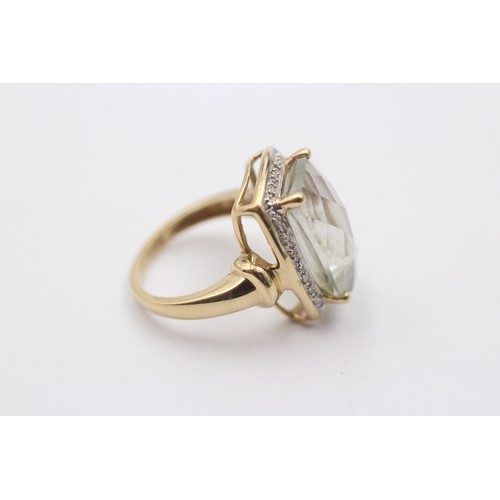 1078 - A 9ct gold green quartz single stone ring with diamond surround - approx. gross weight 5 grams