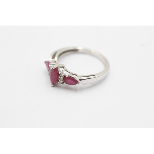 1088 - A 9ct white gold diamond and ruby dress ring - approx. gross weight 2.2 grams