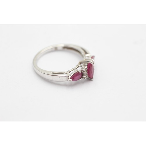 1088 - A 9ct white gold diamond and ruby dress ring - approx. gross weight 2.2 grams