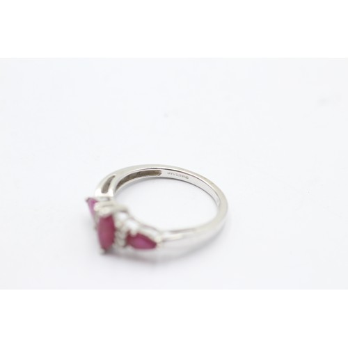 1088 - A 9ct white gold diamond and ruby dress ring - approx. gross weight 2.2 grams