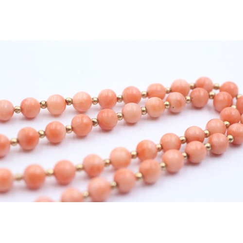 1099 - A coral single strand necklace with 14ct gold clasp and spacers - approx. gross weight 16.7 grams