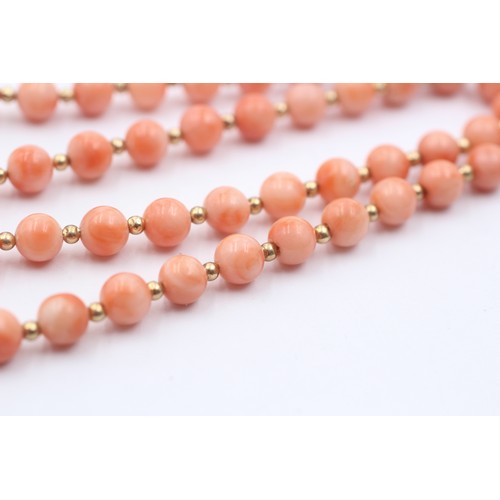 1099 - A coral single strand necklace with 14ct gold clasp and spacers - approx. gross weight 16.7 grams