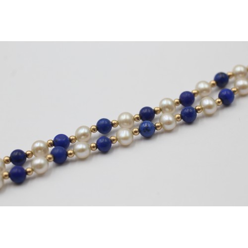 1111 - A cultured pearl and lapis lazuli necklace with 9ct gold clasp and spacers - approx. gross weight 8.... 