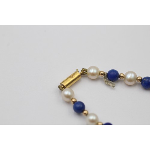 1111 - A cultured pearl and lapis lazuli necklace with 9ct gold clasp and spacers - approx. gross weight 8.... 