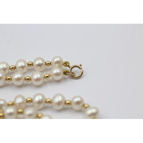 1112 - A cultured pearl necklace with 9ct gold clasp and spacers - approx. gross weight 13.9 grams