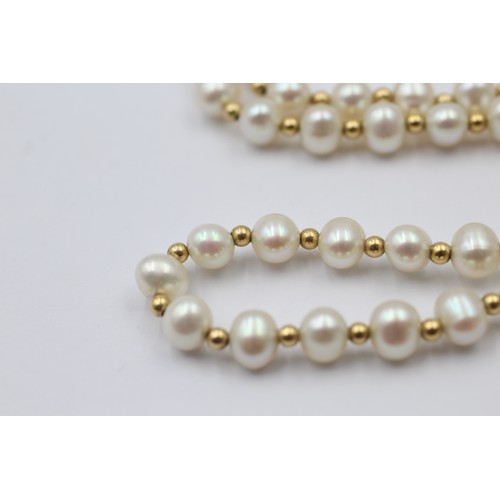 1112 - A cultured pearl necklace with 9ct gold clasp and spacers - approx. gross weight 13.9 grams