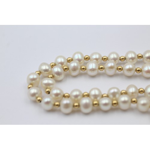 1112 - A cultured pearl necklace with 9ct gold clasp and spacers - approx. gross weight 13.9 grams