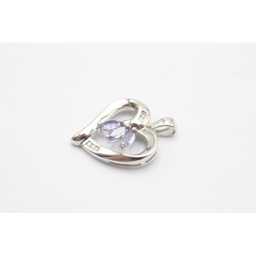 1115 - Two 14ct yellow and white gold tanzanite and diamond heart pendants - approx. gross weight 5.7 grams