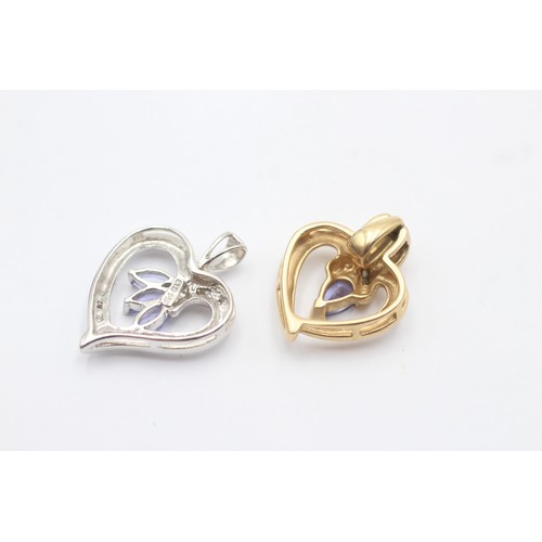 1115 - Two 14ct yellow and white gold tanzanite and diamond heart pendants - approx. gross weight 5.7 grams